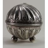 Silver. An unusual silver spherical string holder / dispenser, raised on three ball feet (one foot