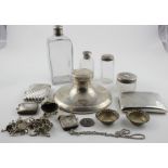 Silver. A collection of silver items, including vesta cases, cigarette cases, silver topped bottles,
