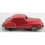 Schuco Gama Patent 100 D.R.P.a. clockwork red saloon car, key missing, untested, length 16cm