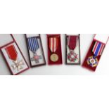 Poland cased medals - Auschwitz Cross, Cross of Merit Silver Clasp, Medal of Victory and Freedom