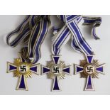 German Mother Cross, Gold, Silver and Bronze versions with ribbons, plus packet for Bronze award (