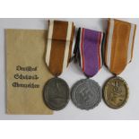 German WW2 West Walls Medals, one with packet of issue, plus a Luftshutz Medal (3)