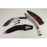 Knives: Kukris: 1) a good Kukri blade 12" with decorated horn grip. In leather scabbard with