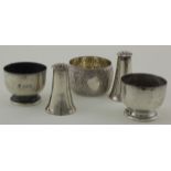Pair of silver peppers and three silver salts. They are hallmarked respectively for London 1897,