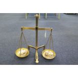 Brass set of scales by Marsden & Co., height 45.5cm approx., with five weights