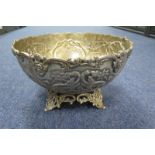 Large silver plated ornate punch bowl, raised on four feet, height 18cm, diameter 31.5cm approx.