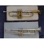 Besson Brevete brass trumpet, contained in a fitted case, together with another cased trumpet