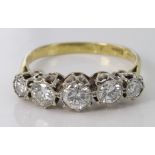 18ct diamond five stone carved head ring, approx 1.50ct total. Size L, weight 3.7g