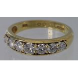 18ct diamond seven stone graduated half eternity ring, approx. 1ct total weight. Size Q, weight 4.