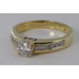 18ct yellow gold diamond solitaire with diamond shoulders, approx. 0.50ct, size K, weight 4.1g