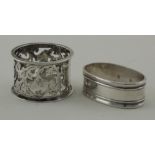 Two silver napkin rings - one bears British hallmarks "R.P. Birm. 1901" and the other is Continental