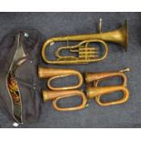 Four brass & copper bugles, together with another instrument, two missing mouthpieces