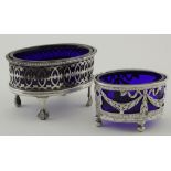 Two silver salts with blue glass liners - one hallmarked "HVAV, London, 1909", one Continental