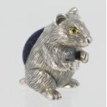 Silver pin cushion in the form of a rodent, marked sterling. Approx 27mm tall