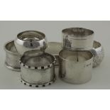 Seven silver British hallmarked napkin rings, includes one Victorian example. Weight of silver 4.