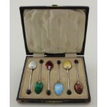 Very attractive boxed set of six enamel & silver, bean top coffee spoons; the spoon with brown
