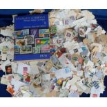 Stamps, a large accumulation of GB and World stamps, loose, on paper, in glassines etc, many