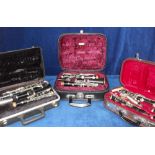 Musical Instruments, three clarinets, all in original hard cases, Rosewood Leslie Sheppard foreign