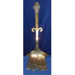 Collectables, brass slotted shovel approx 60 cms long. Handle terminates in Bishop's mitre, shovel