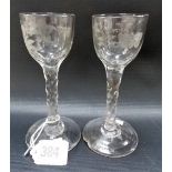Pair of 18th Century cordial glasses, the bowls engraved with a spray of flowers and opposing