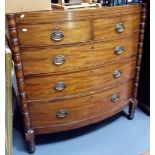 19th Century mahogany bow front chest of two short over three long drawers flanked by ring turned