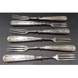 Set of six dessert forks with white metal filled handles.