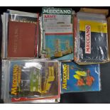 A collection of Meccano magazines and vintage instruction booklets