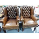 Pair of 19th Century style brown leather upholstered wingback armchairs; together with a footstool