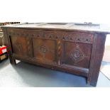 18th Century oak panelled coffer, the three panelled hinged lid over the three panel front with