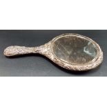 Edwardian silver embossed hand mirror, decorated with leaf scrolls, birds and putti, Chester 1906 (