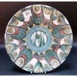 An Alan Caiger-Smith Aldermaston Pottery earthenware tin glaze dish, decorated with stylised feather