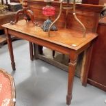 Victorian walnut side table with raised back and upon square tapering forelegs, width 47.5'.