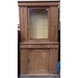 Victorian pine Cornish dresser, the top with a single glazed door enclosing three shelves, the