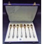 Continental white metal boxed set of six tea spoons and a scoop with gilt bowls, weight 91g approx