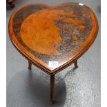 Heart shaped sweetheart table with pokered work decoration of the man on the moon and stars upon