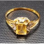 Modern yellow metal citrine and diamond chip dress ring, weight 1.2g approx, stamped 375.