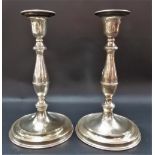 Pair of silver plate on copper baluster candlesticks, height 10in.