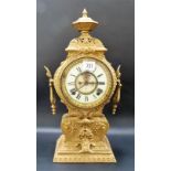 Spelter two-train mantel clock, the 4.5in enamel dial with recess visible escapement, height 17in