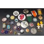 Collection of vintage metal badges, some in enamel.