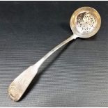 George IV Scottish silver fiddle and shell pattern sifter spoon by Andrew Wilkei, retailed by