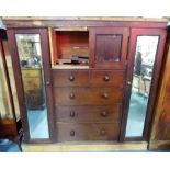 Victorian mahogany compactum wardrobe with moulded cornice over a pair of cupboard doors and two