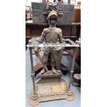 Victorian cast iron umbrella and stick stand, the back cast in the form of a knight in armour with