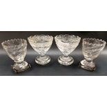 Pair of 19th Century glass salt cellars, the lobed rim over a hobnail cut band and facet body and