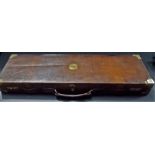 Good early 20th Century leather brassbound rectangular gun case with carry handle and with fitted