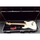 A Fender Stratocaster American made electric guitar, serial no. Z8007417 with cream coloured body,