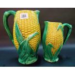 Pair of graduated Victorian majolica corn relief moulded jugs