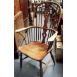 19th Century wheel and stick back Windsor chair with shaped seat upon turned legs united by a H