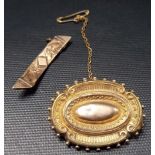 Victorian yellow metal oval brooch (af); together with a gold faced bar brooch, weight of oval