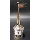 A white metal pierced incense burner with interior bell and flag surmount.