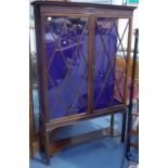 An early 20th Century mahogany display cabinet in Chippendale style by Jas. Shoolbred & Co,